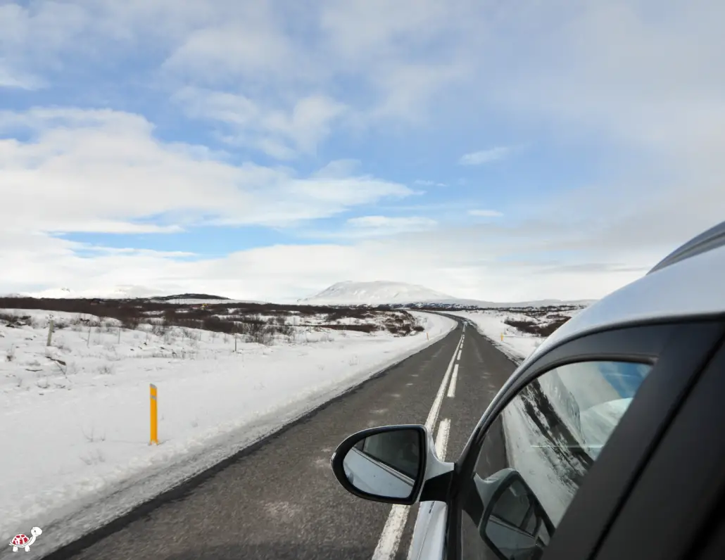 winter road trip car in snow